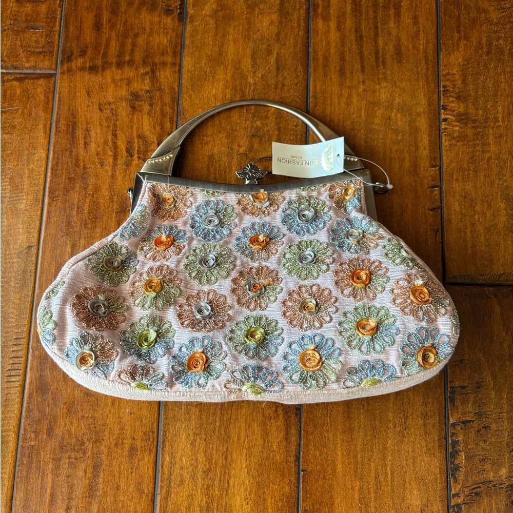 Vintage style flier beaded purse in pink wrinkle satin.